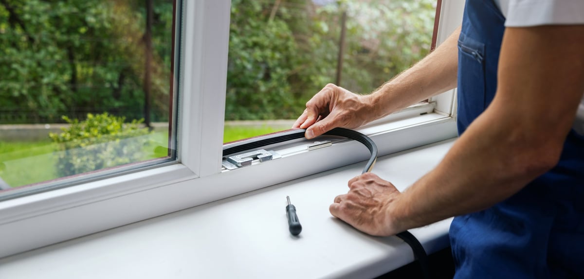 Replacement double glazing unit being fitted in a UK home