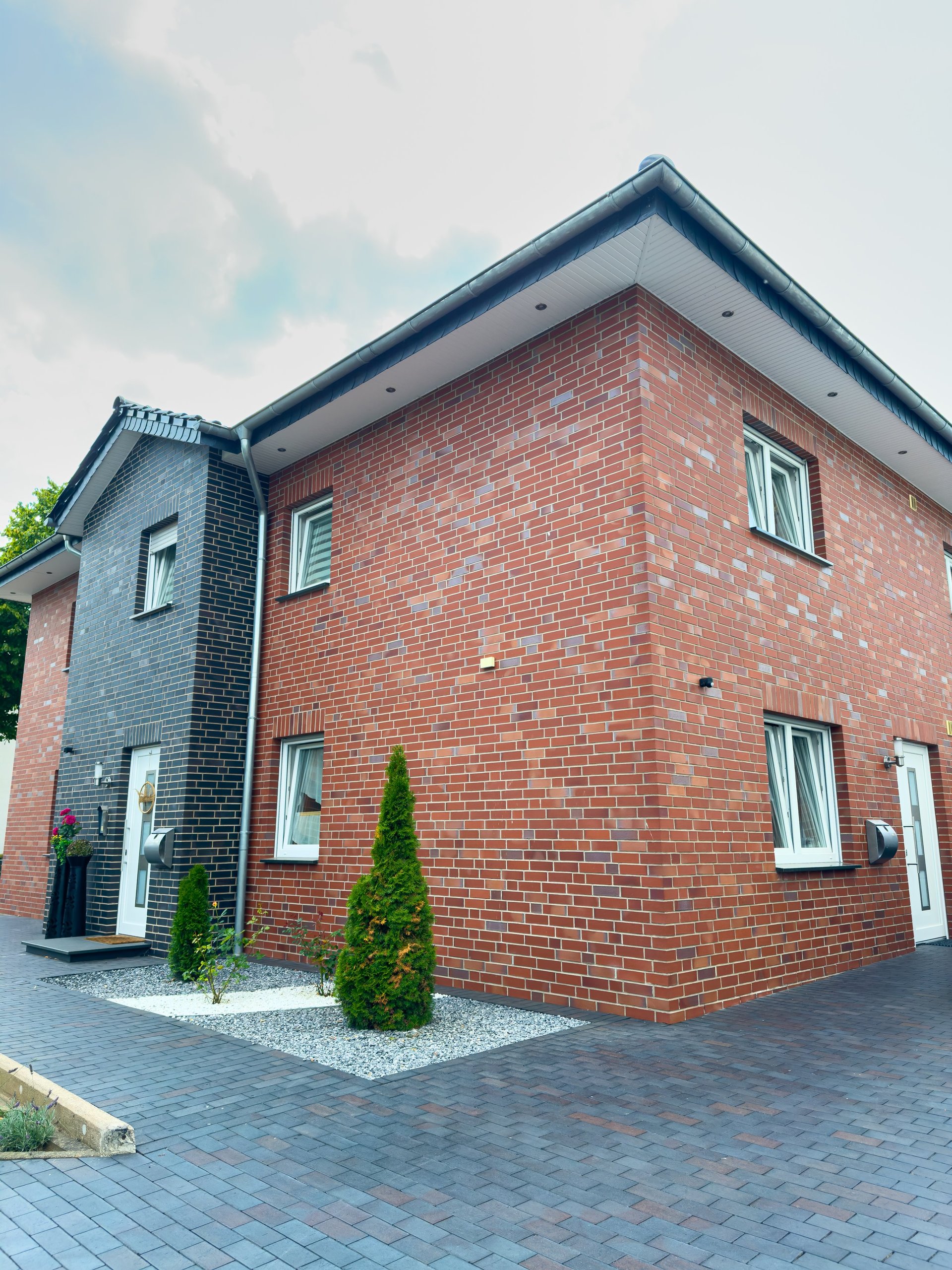 Modern British home with white uPVC windows and composite front door